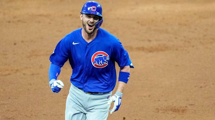 April 26, 2021; Cumberland, Georgia, USA; Chicago Cubs third baseman Kris Bryant (17) reacts after hitting a grand slam home run against the Atlanta Braves during the third inning at Truist Park.